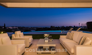Frontline golf luxury villa in an elegant modern style with stunning golf and sea views for sale in Los Flamingos Golf resort in Marbella - Benahavis 48961 